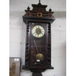 Mahogany cased wall clock with carved detail
