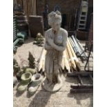 Concrete garden statue of lady