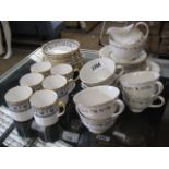 Quantity of Royal Doulton gilt decorated teacups, saucers and milk jug with quantity of