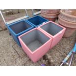 2 pink and 2 blue square planters