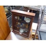 Trinket display cabinet with contents