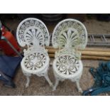 Pair of white metal garden chairs