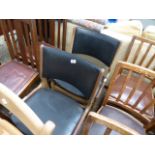 Pair of wooden framed black vinyl seated chairs