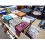 Large table top of assorted vinyl records and singles