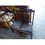 Pair of oak chairs with vinyl drop in seats