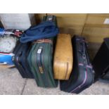 5 assorted luggage cases