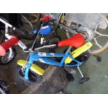 Red, blue and yellow childs bike with stabilizers