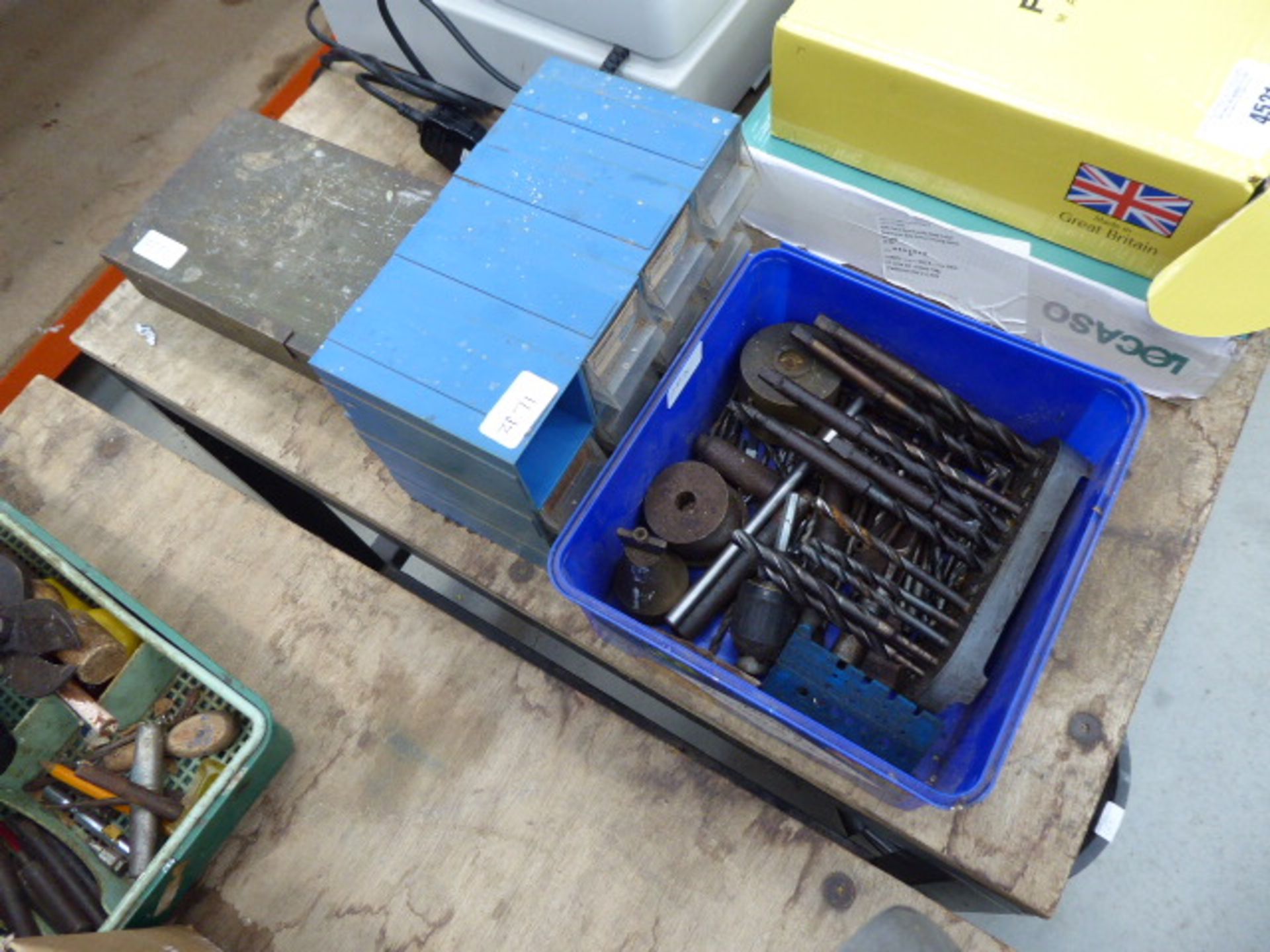 Small plastic box of drill bits, box of fixings and a small metal tin containing tacks