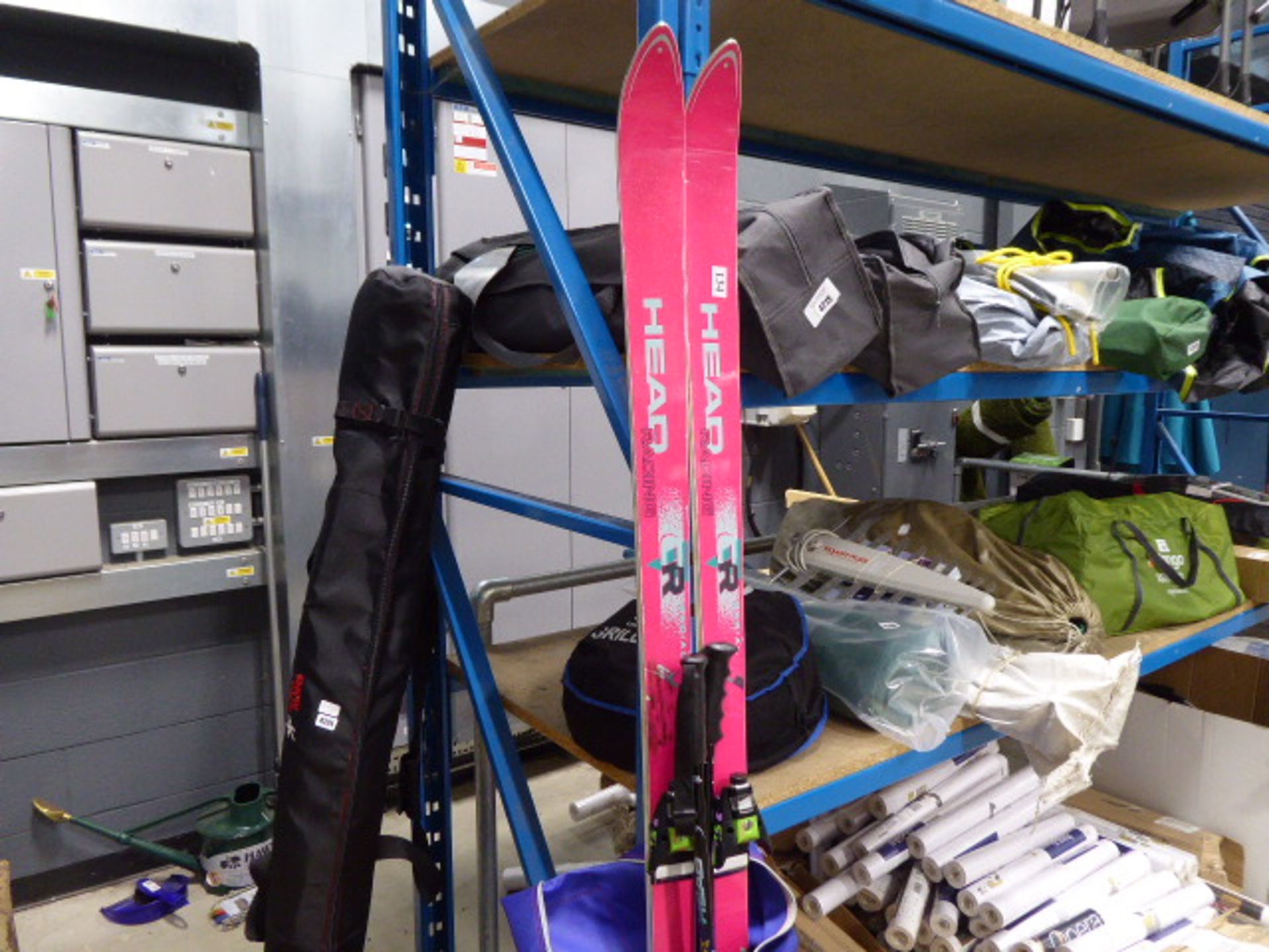 Pair of bagged skis and ski boots