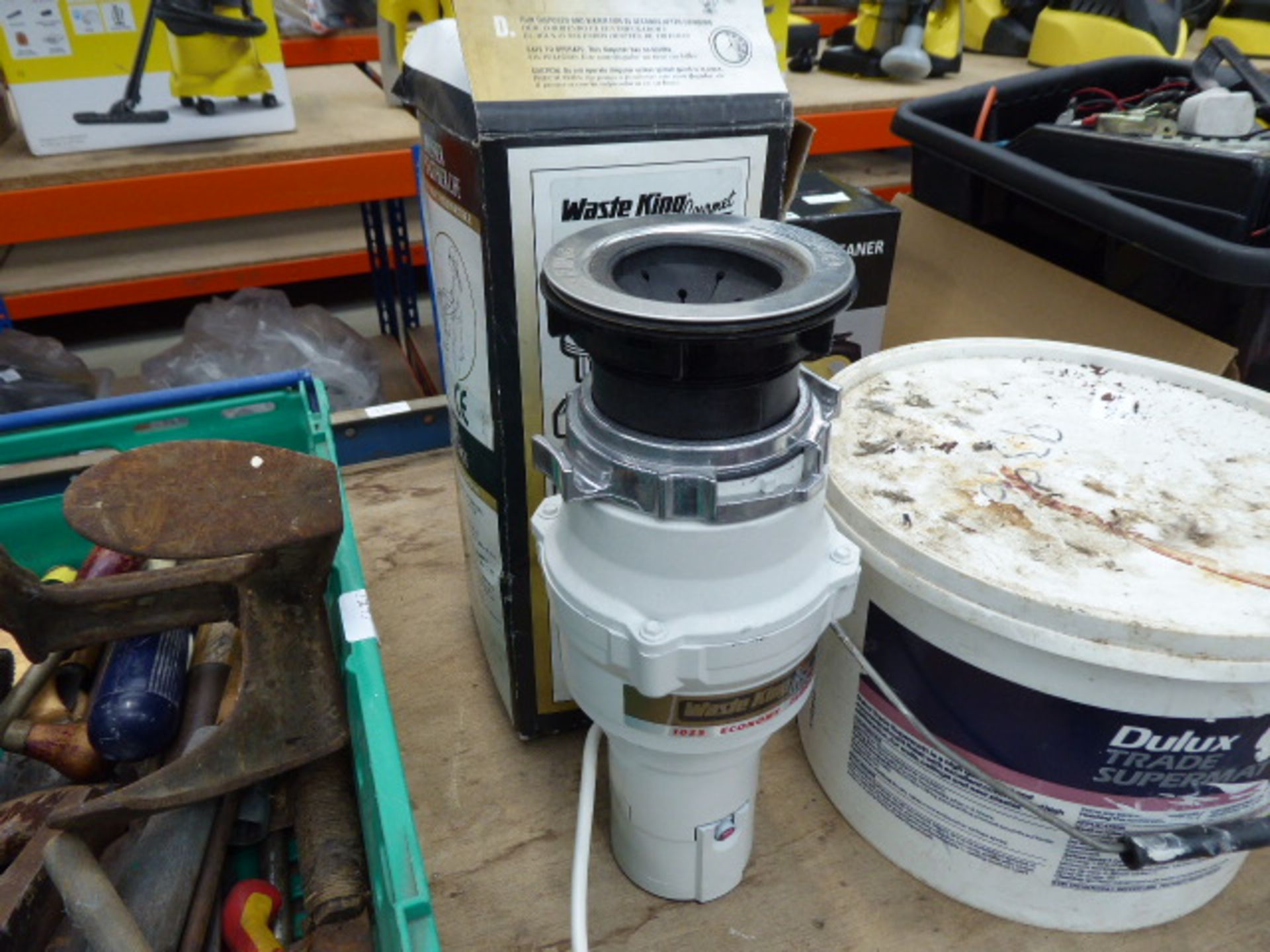 Waste disposal unit and a tub of fixings