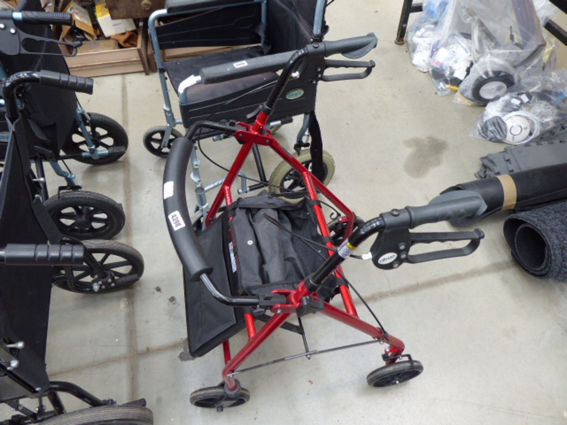 Red fold up 4 wheel mobility walking aid