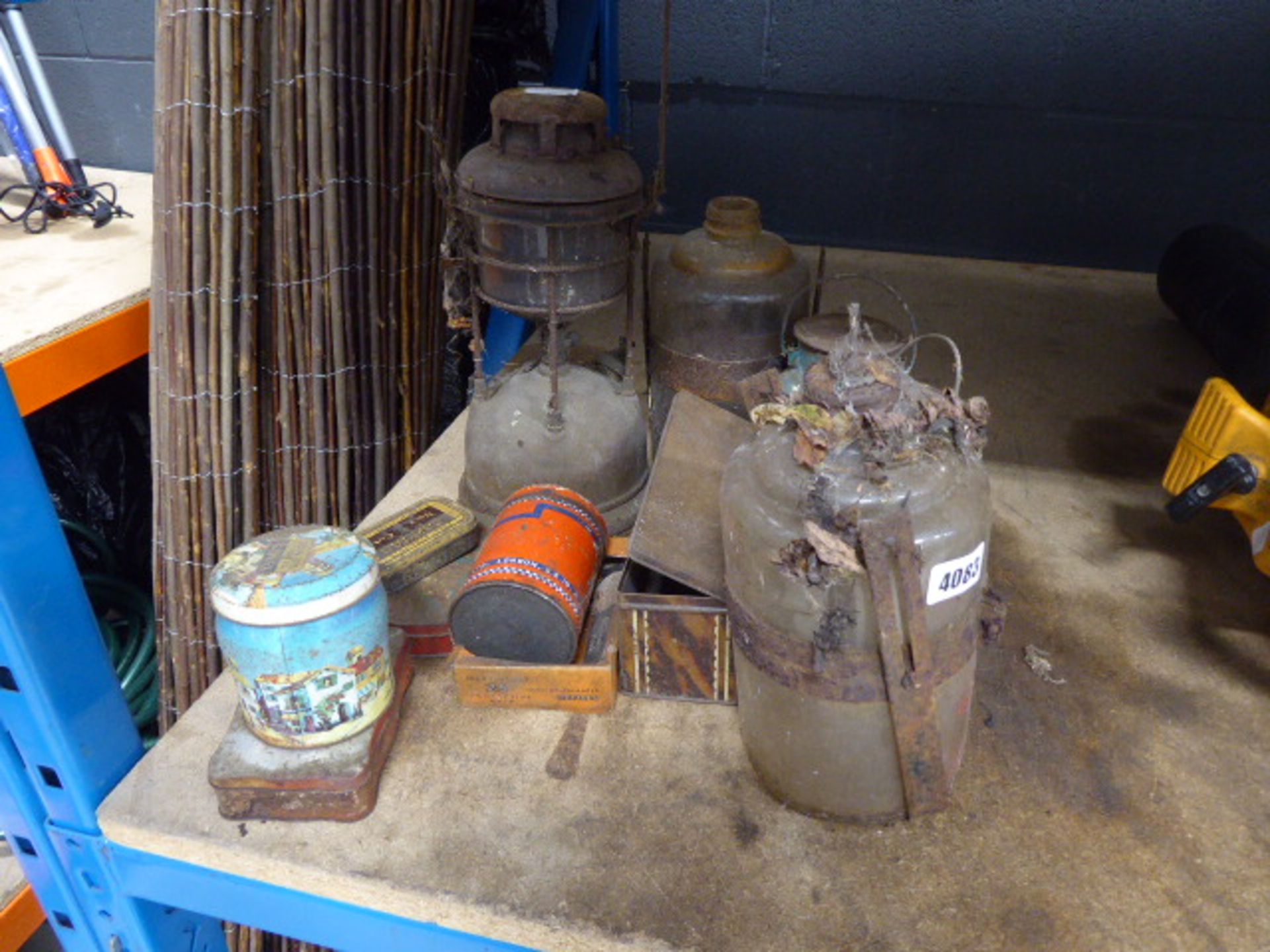 Quantity of vintage tins, oil lamps and jars