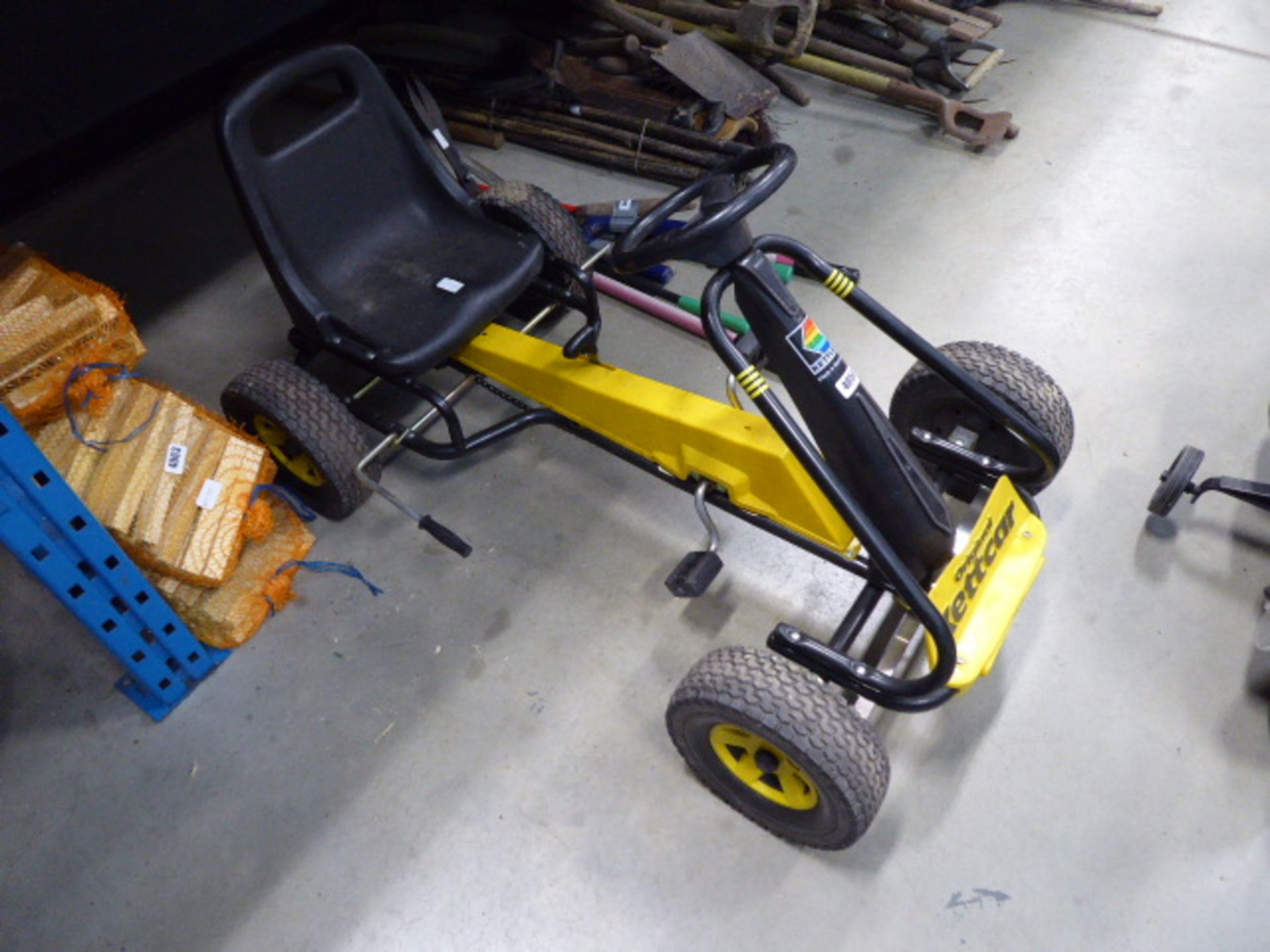 Yellow and black Ketler 4 wheel go kart