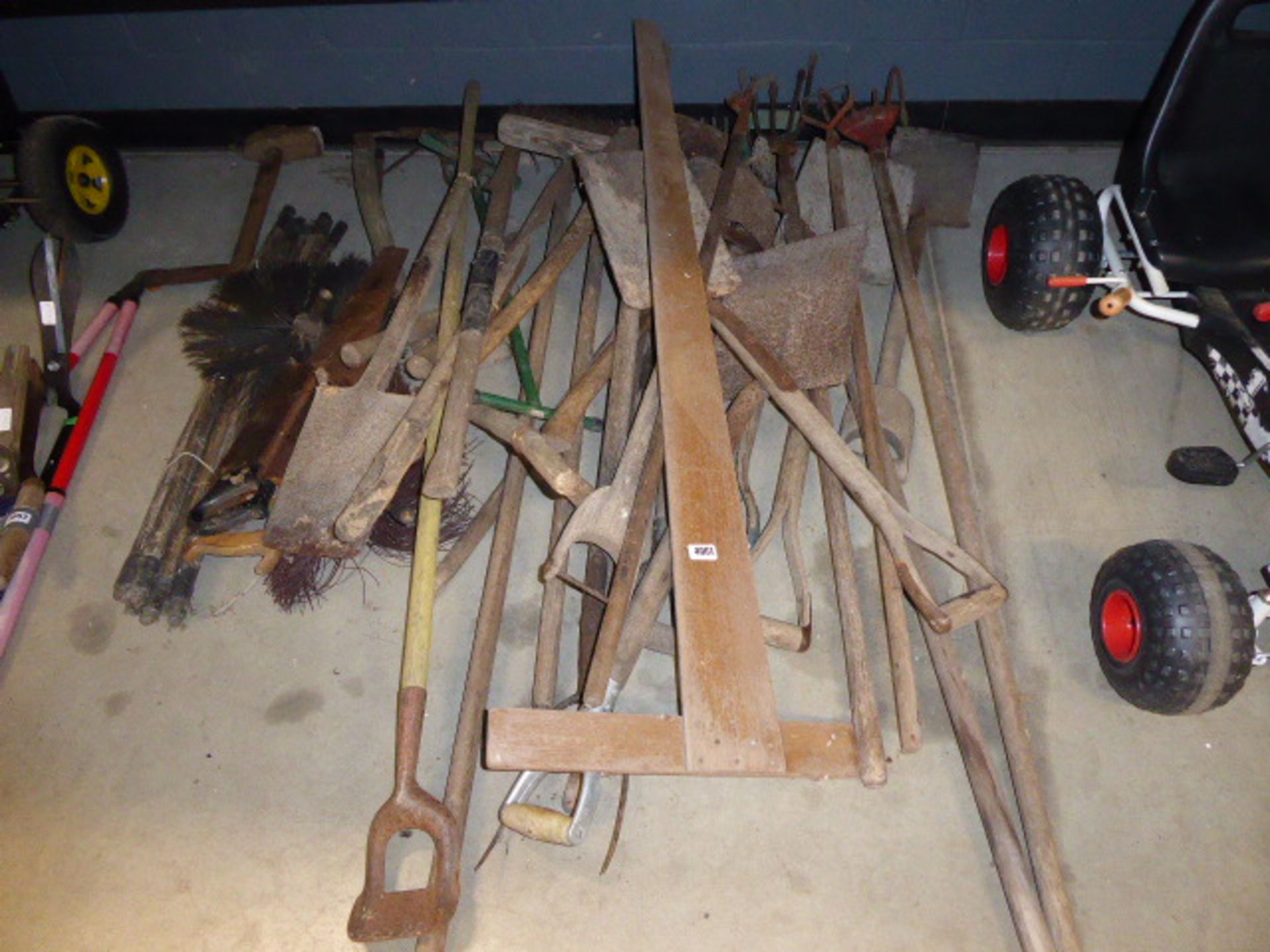 Half bay of assorted garden tools