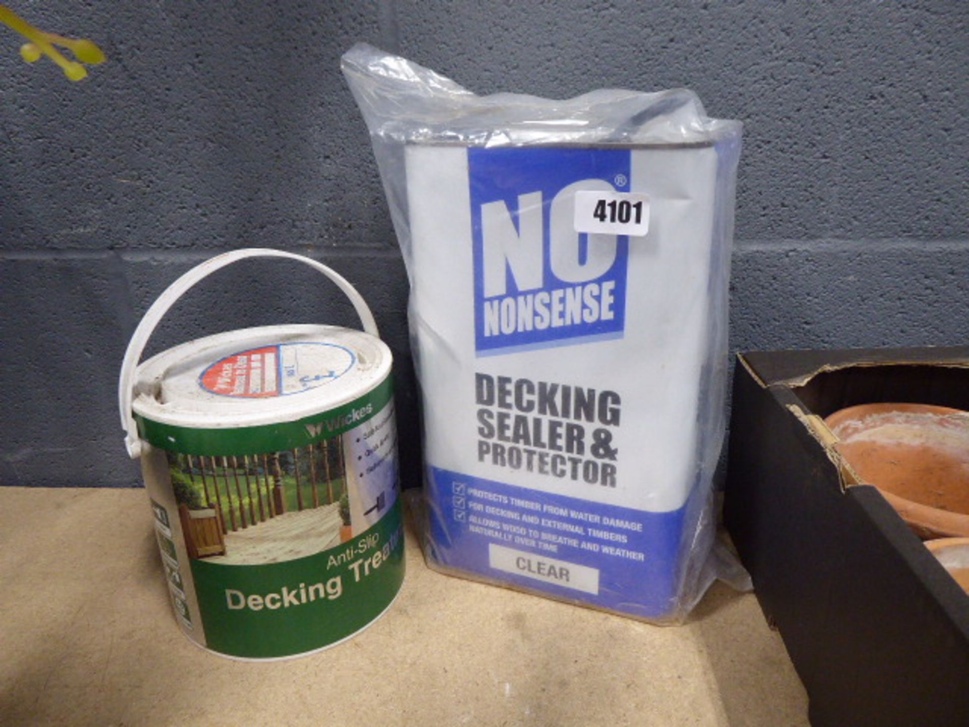 Tin of decking sealer and protector and some anti-slip decking treatment