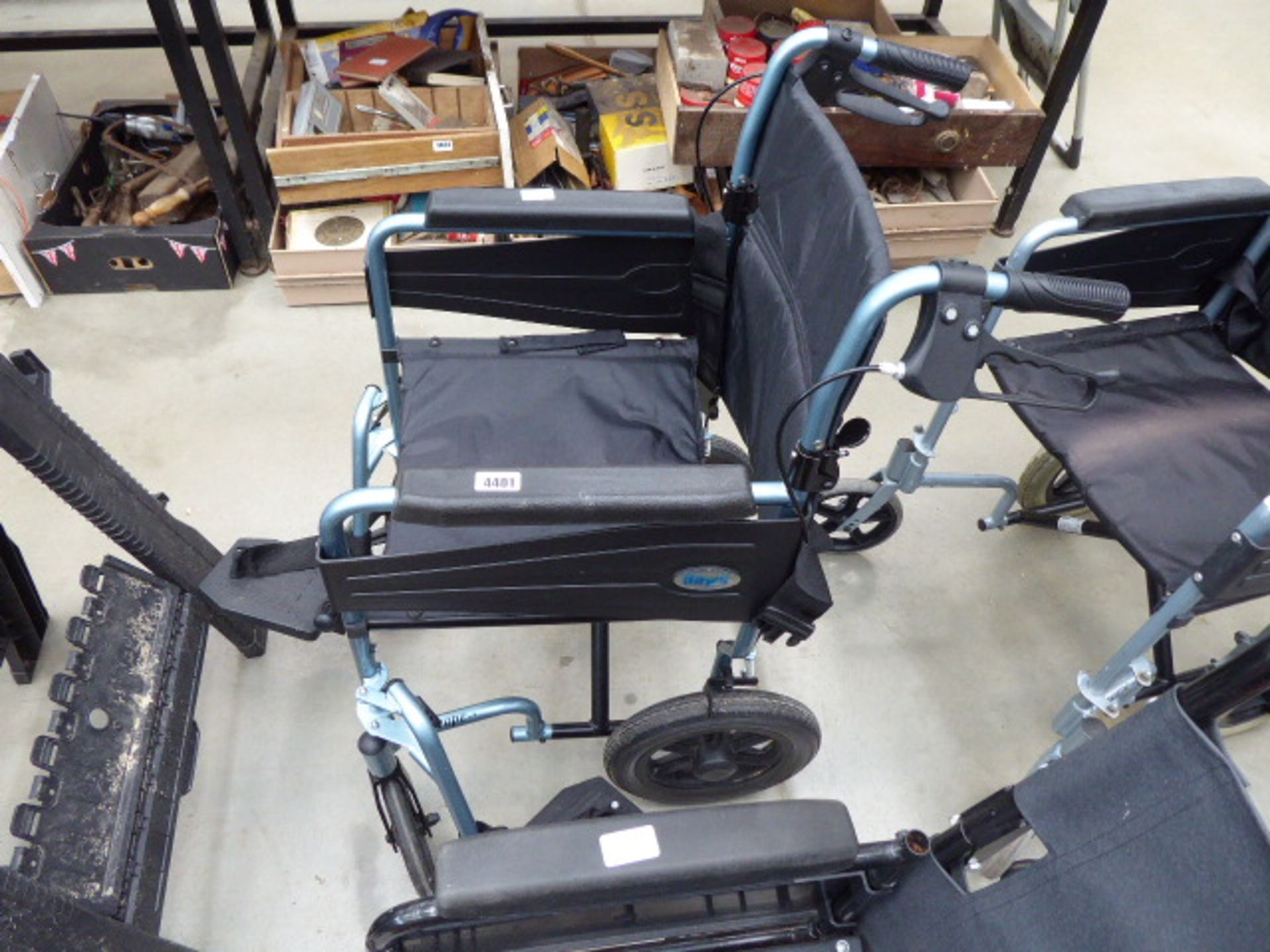 Escape blue and black fold up wheelchair with foot rest