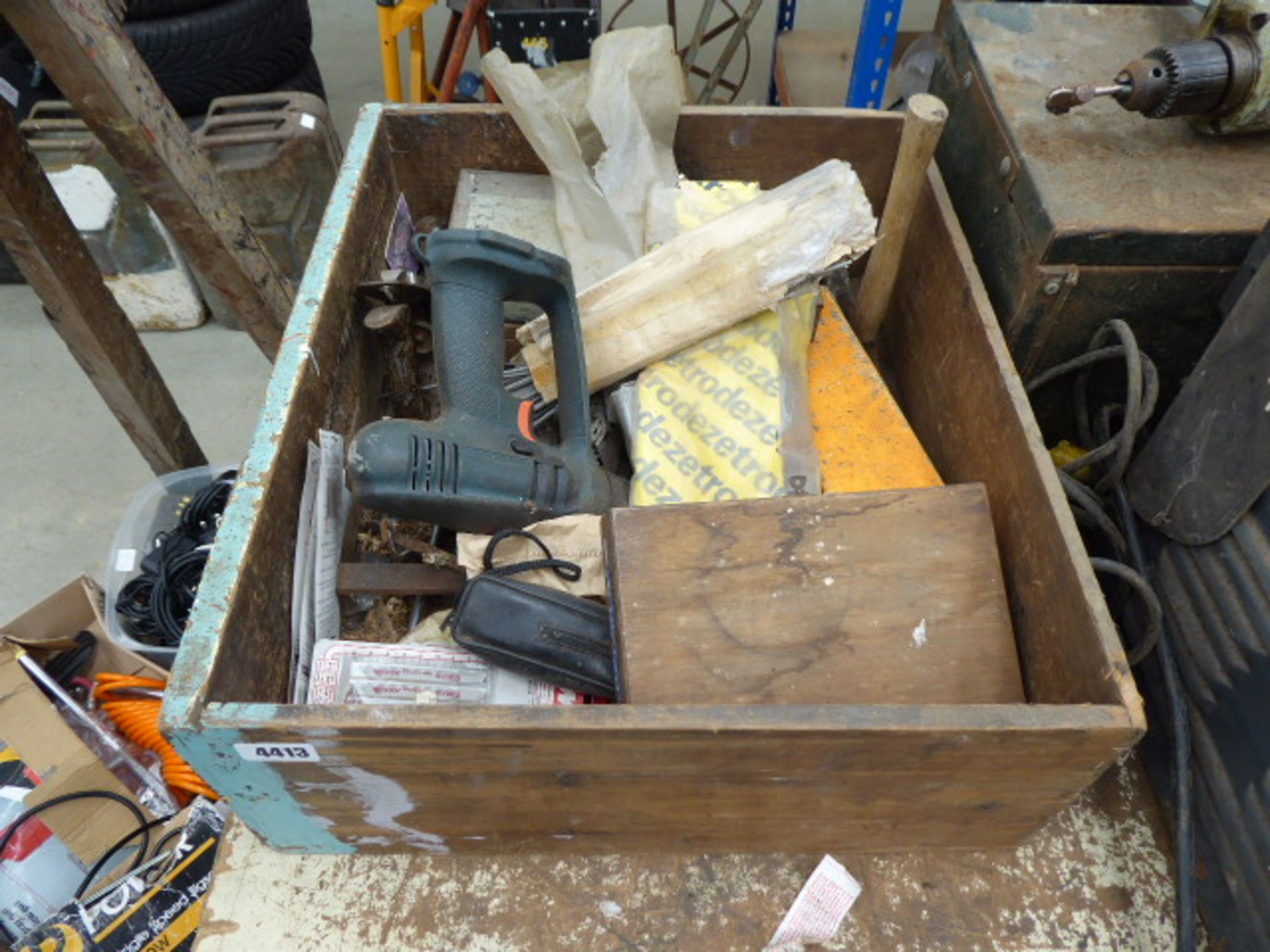 Wooden box containing welding rods, drill, saw blades, hammers etc