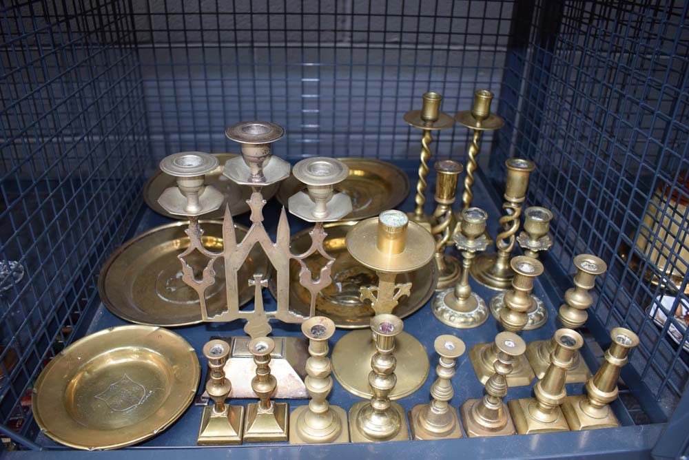 Cage containing quantity of brass candlesticks and dishes