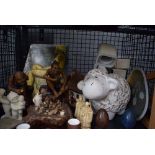 Cage containing resin Chinese figures, stone eggs, pottery and table lamp