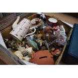 Box containing ornamental figures, teapot, money boxes and champagne glass