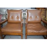 5093 Pair of oak framed armchairs in brown vinyl upholstery