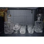 Cage containing crystal decanters, brandy snifters and tumblers