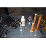 Cage containing ginger beer bottle, vets syringe, 19th century corkscrew, industrial wooden bobbins,