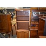 Early 20th century oak open fronted bookcase with concealed cupboard to the back (possibly to