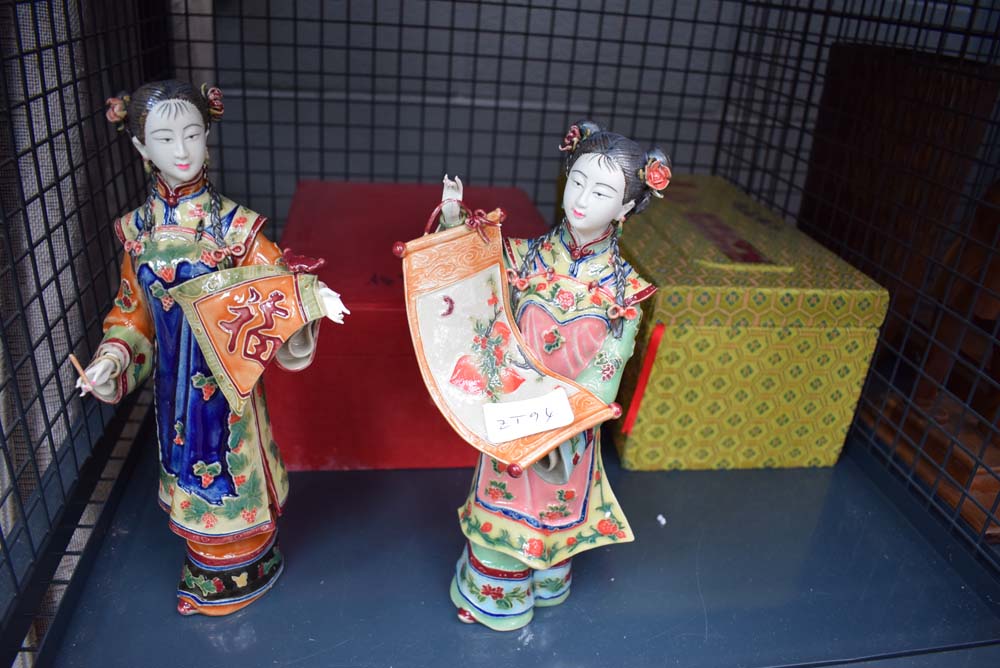 Cage containing 2 Oriental figures