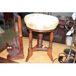 29 A Victorian oak and upholstered stool with four columns, platform base and splayed feet