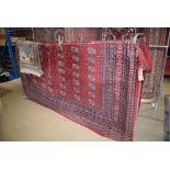 (7) 3m x 3 1/2m red Bokhara carpet