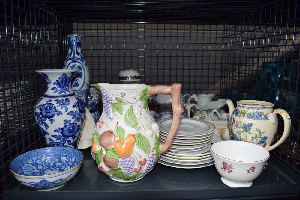 Cage containing ginger jar, blue and white vases, plus gravy boats and milk jugs