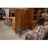 Reproduction walnut double door drinks cabinet with drawer under on cabriole legs, opening to reveal