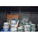 Cage containing Midwinter crockery