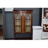 Edwardian mahogany strung and inlaid display cabinet with lined interior