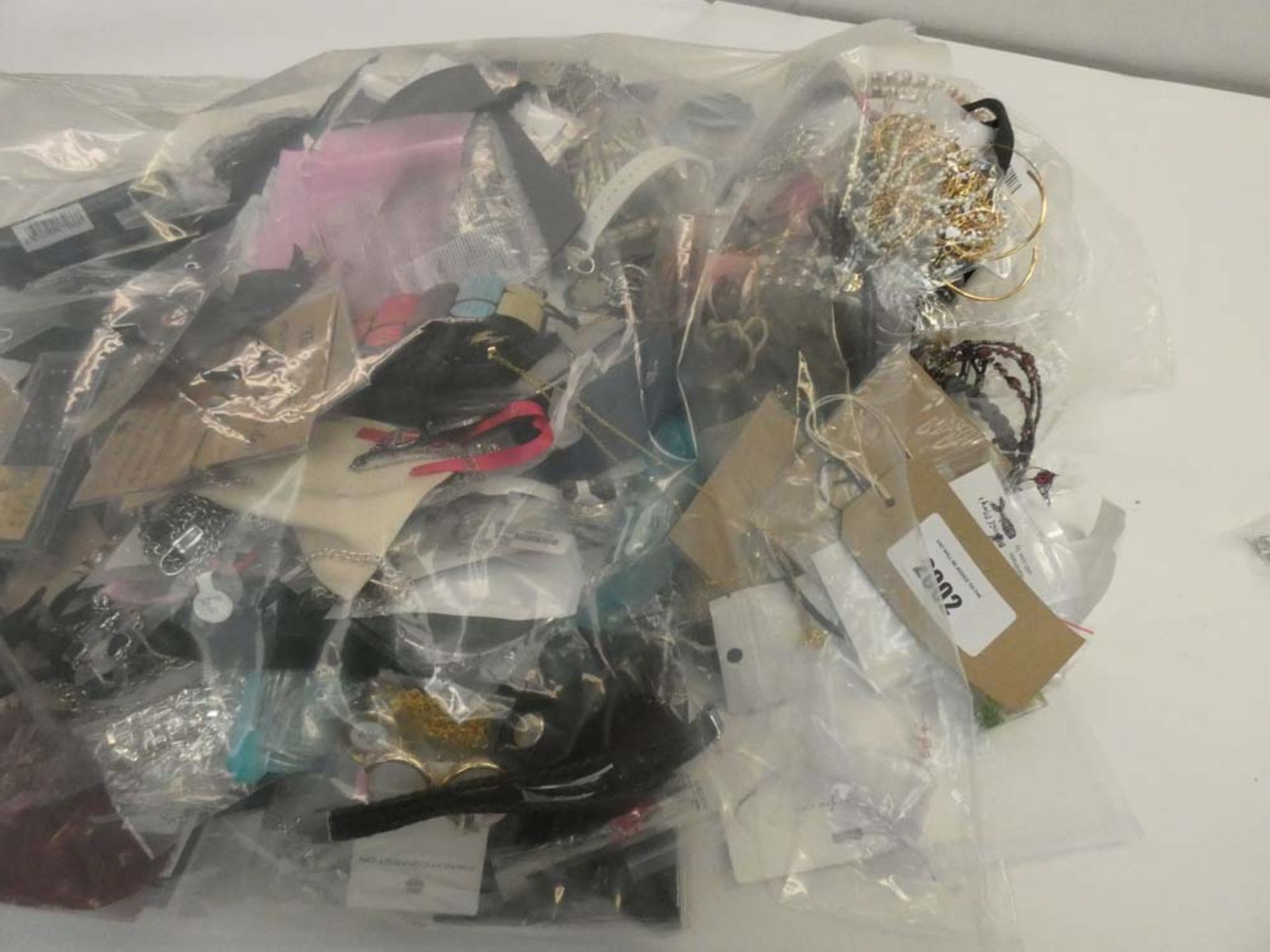 Bag containing quantity of loose costume and dress jewellery