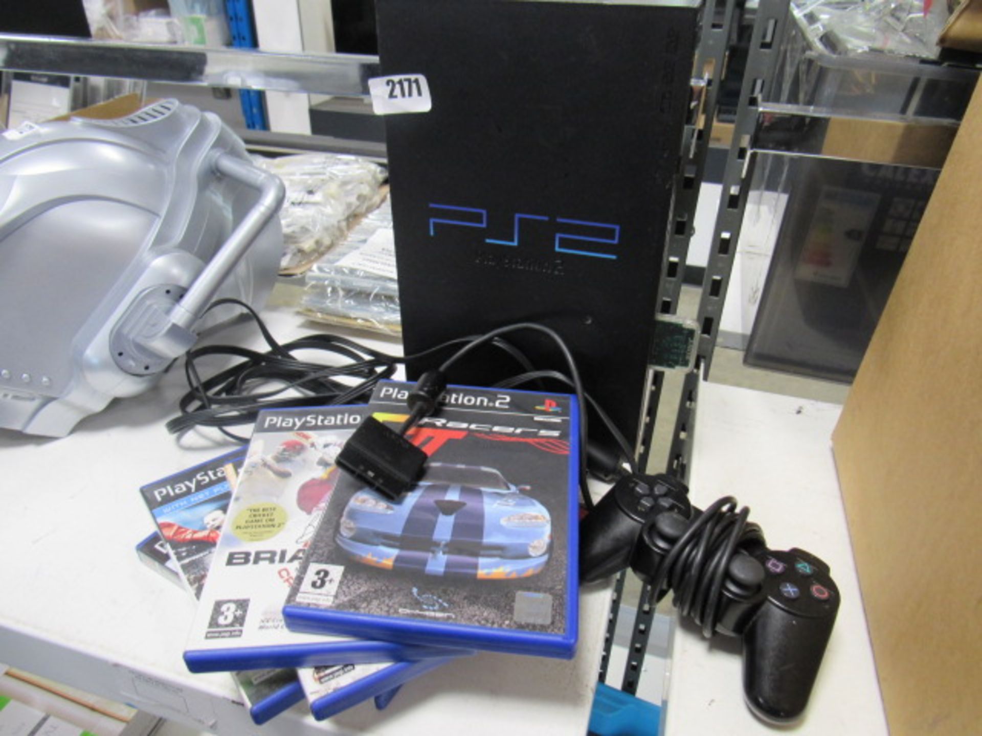 Sony Playstation 2 games console with controller and some games