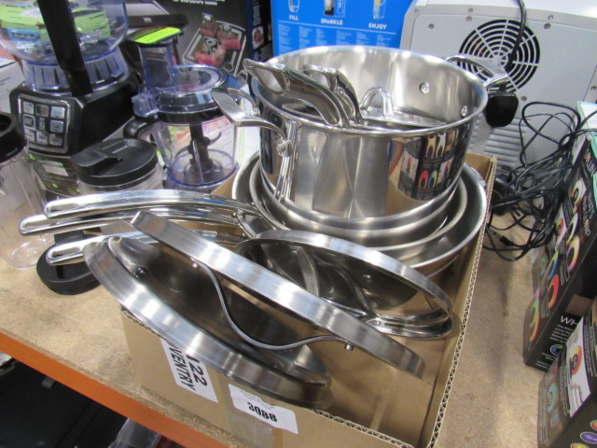 Box containing used Kirkland pots and pans