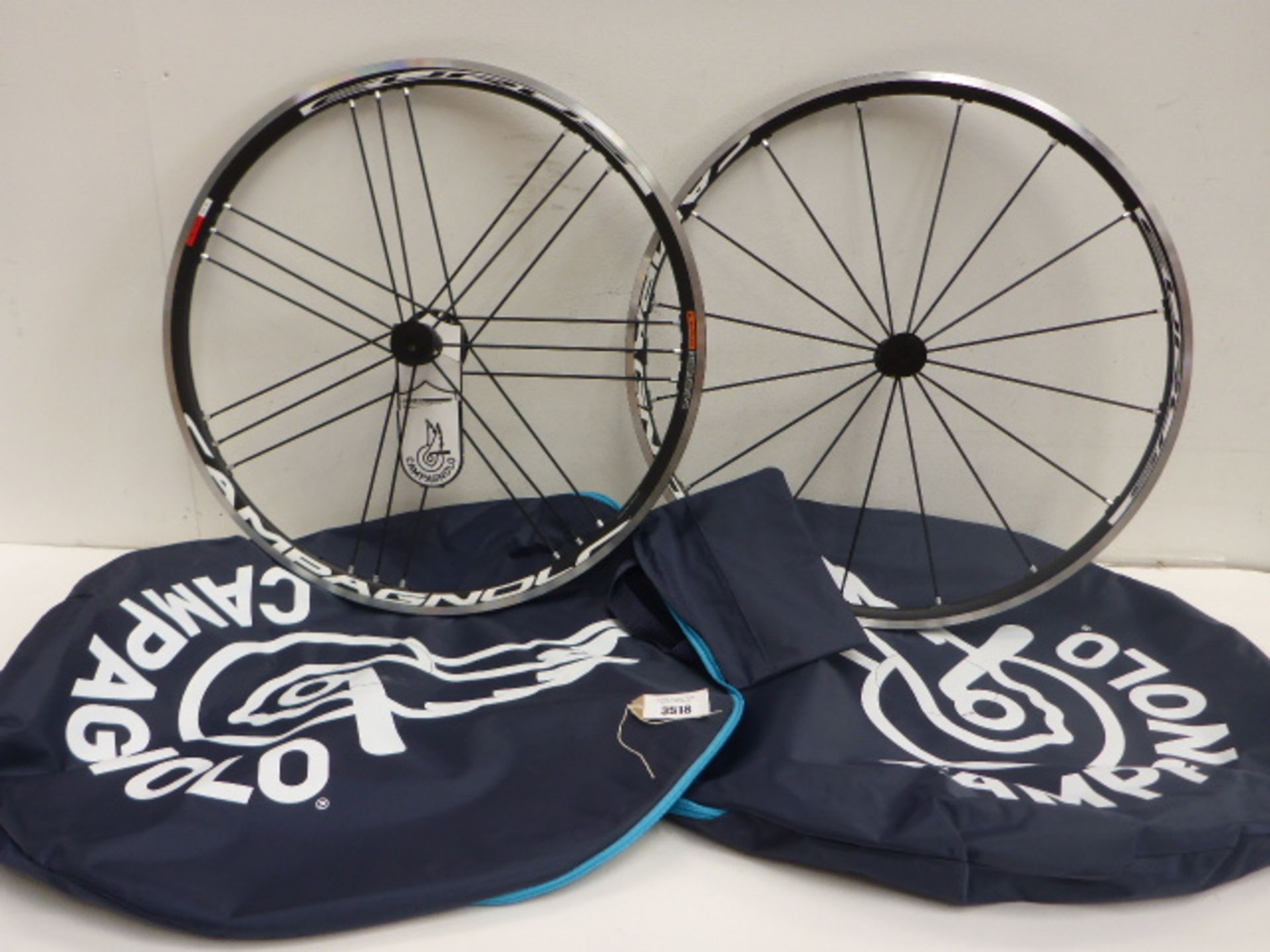2 Campagnolo Eurus bike wheels and protective zip up carry cases