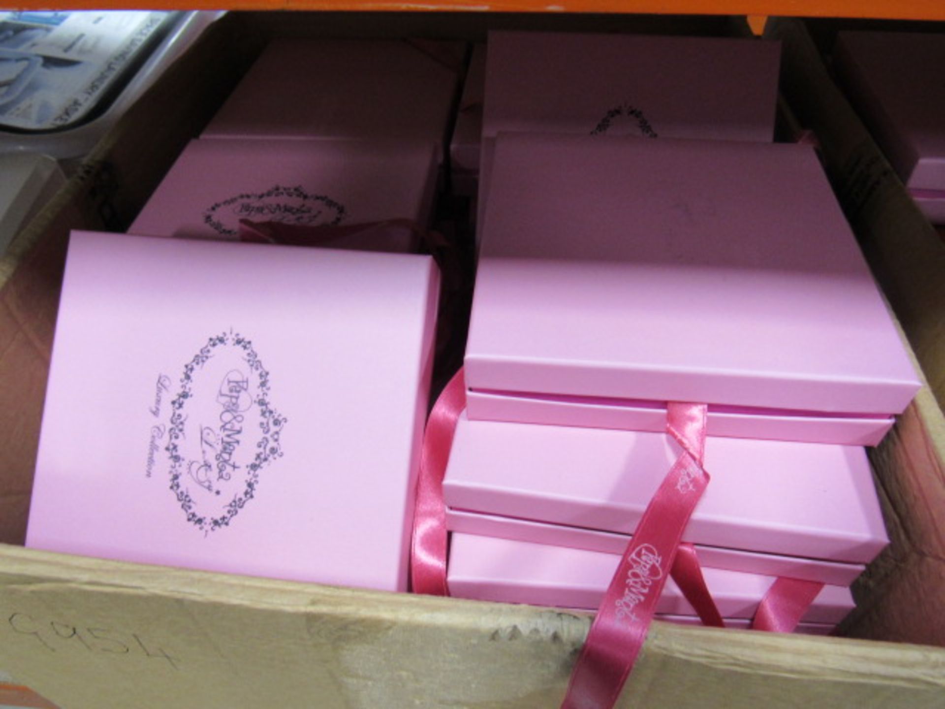 Box of empty pink gift boxes