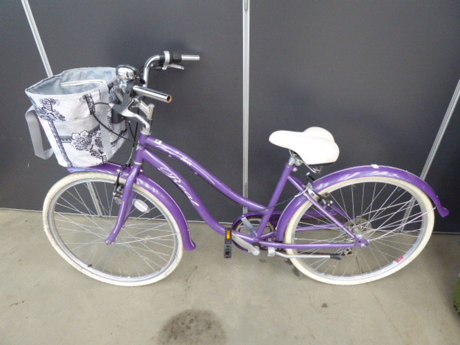 Purple ladies bike with front bag