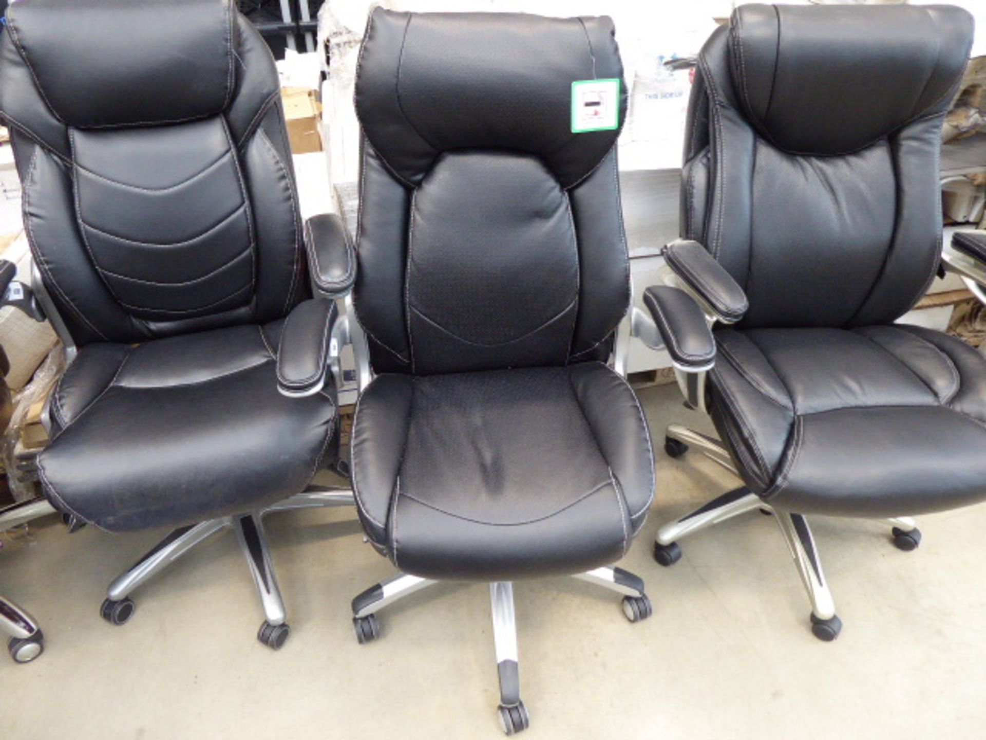 Black high backed executive style swivel armchair