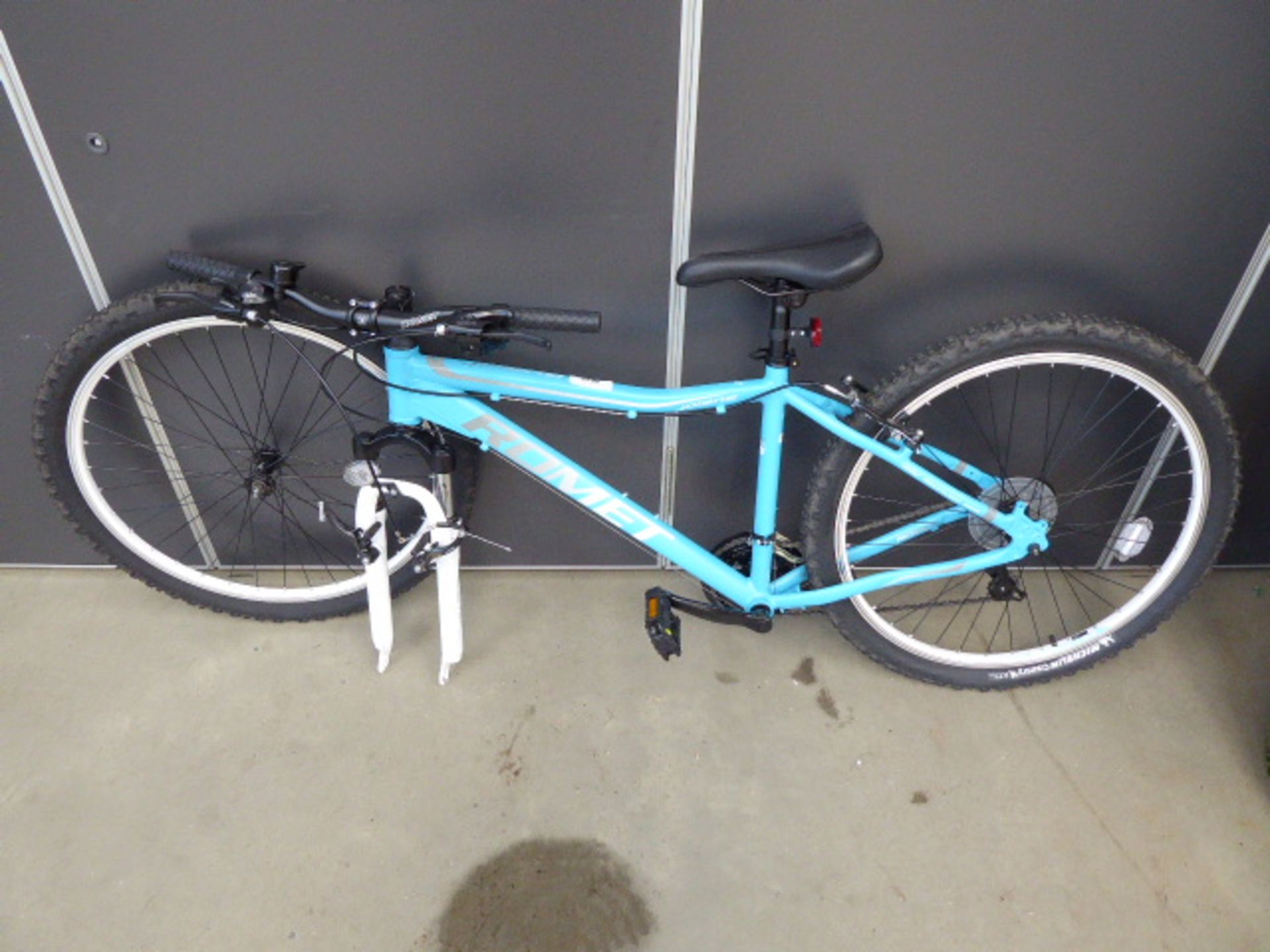 Blue Joiane mountain bike, front wheel unattached