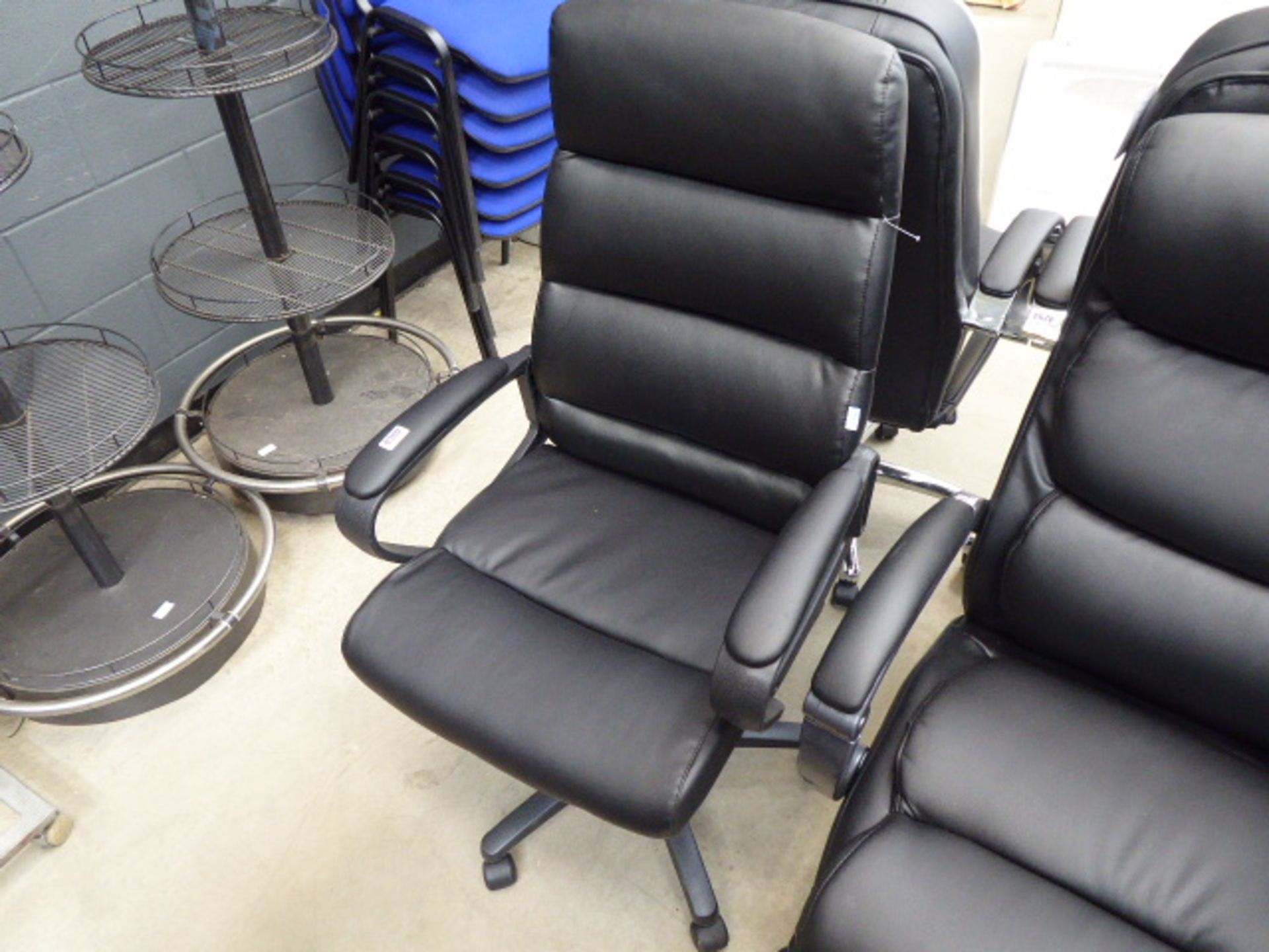 Black high backed swivel armchair