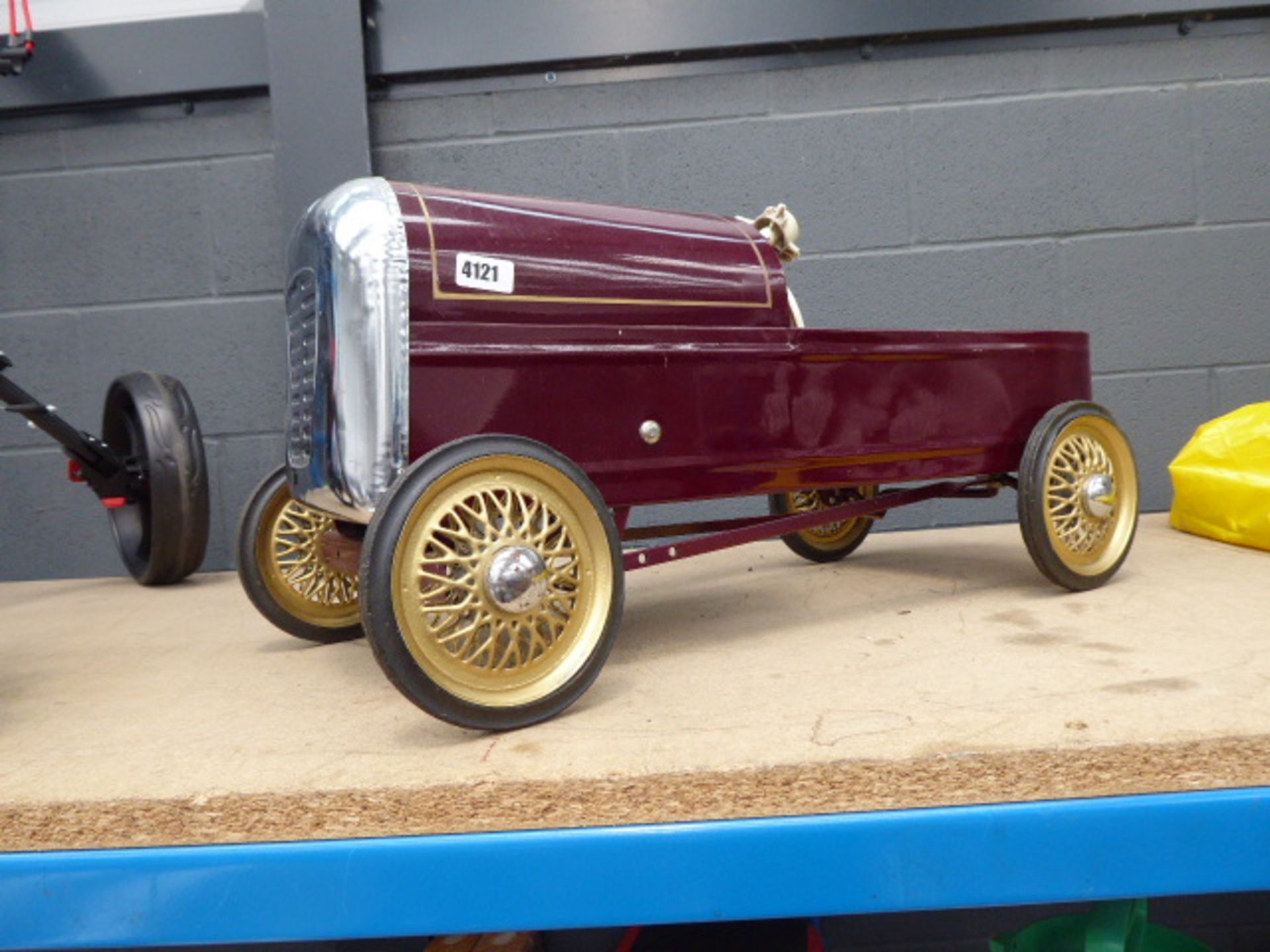 Vintage burgundy child's 4 wheel car