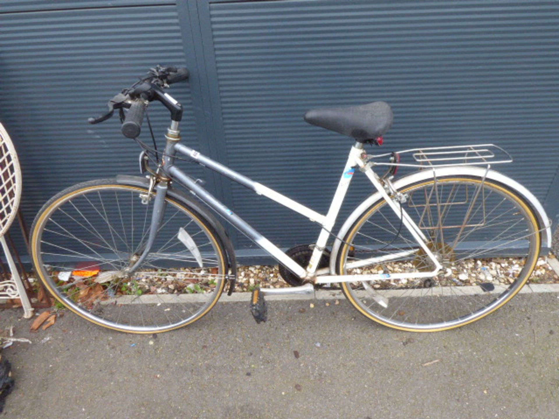 Grey and white ladies bike