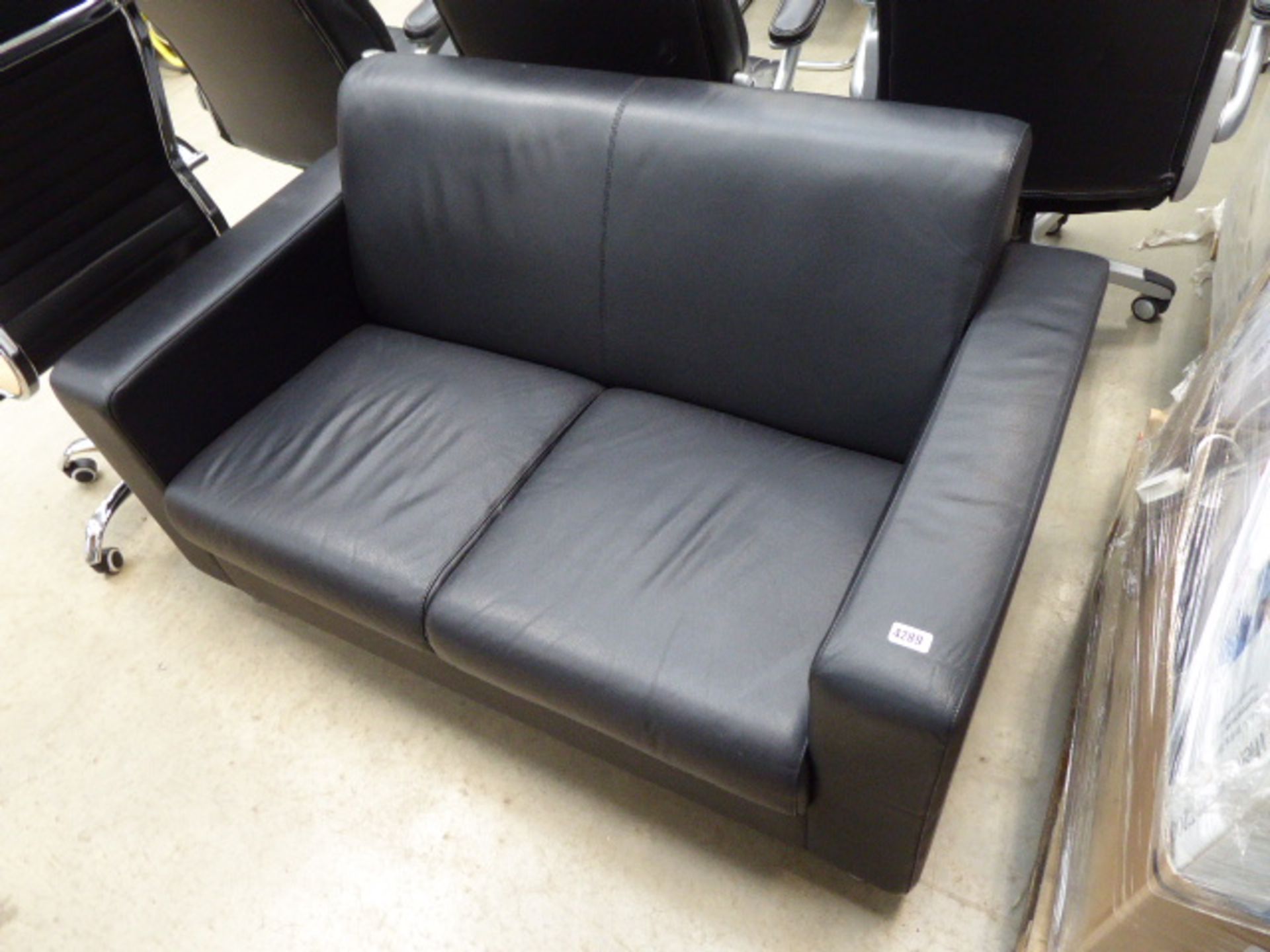 Black 2-seater leather-effect sofa