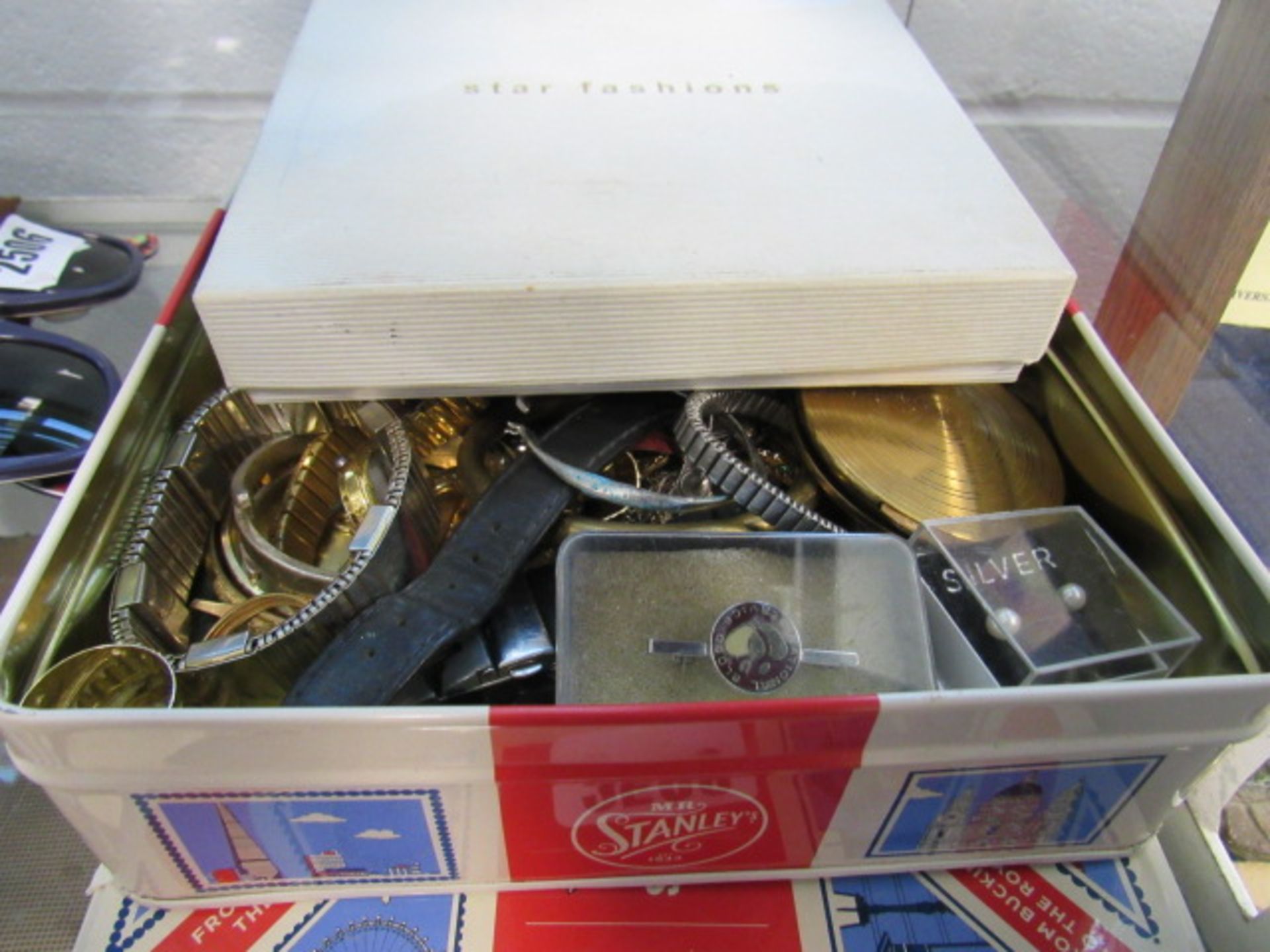 Tin and box of various dress jewellery, watches etc