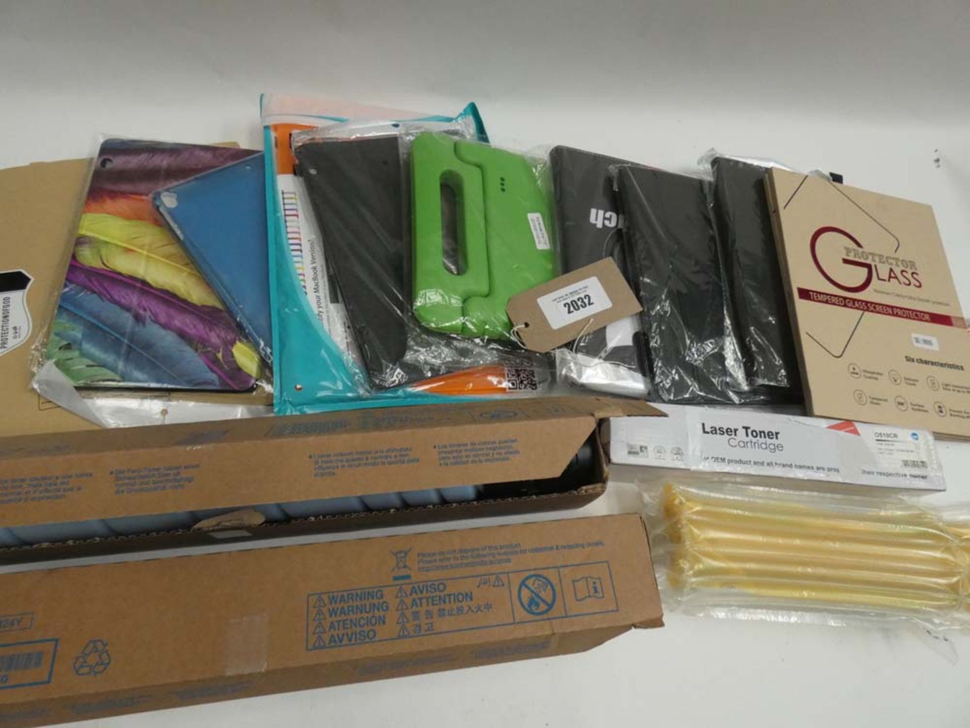 Bag containing various tablet cases/covers and printer toner