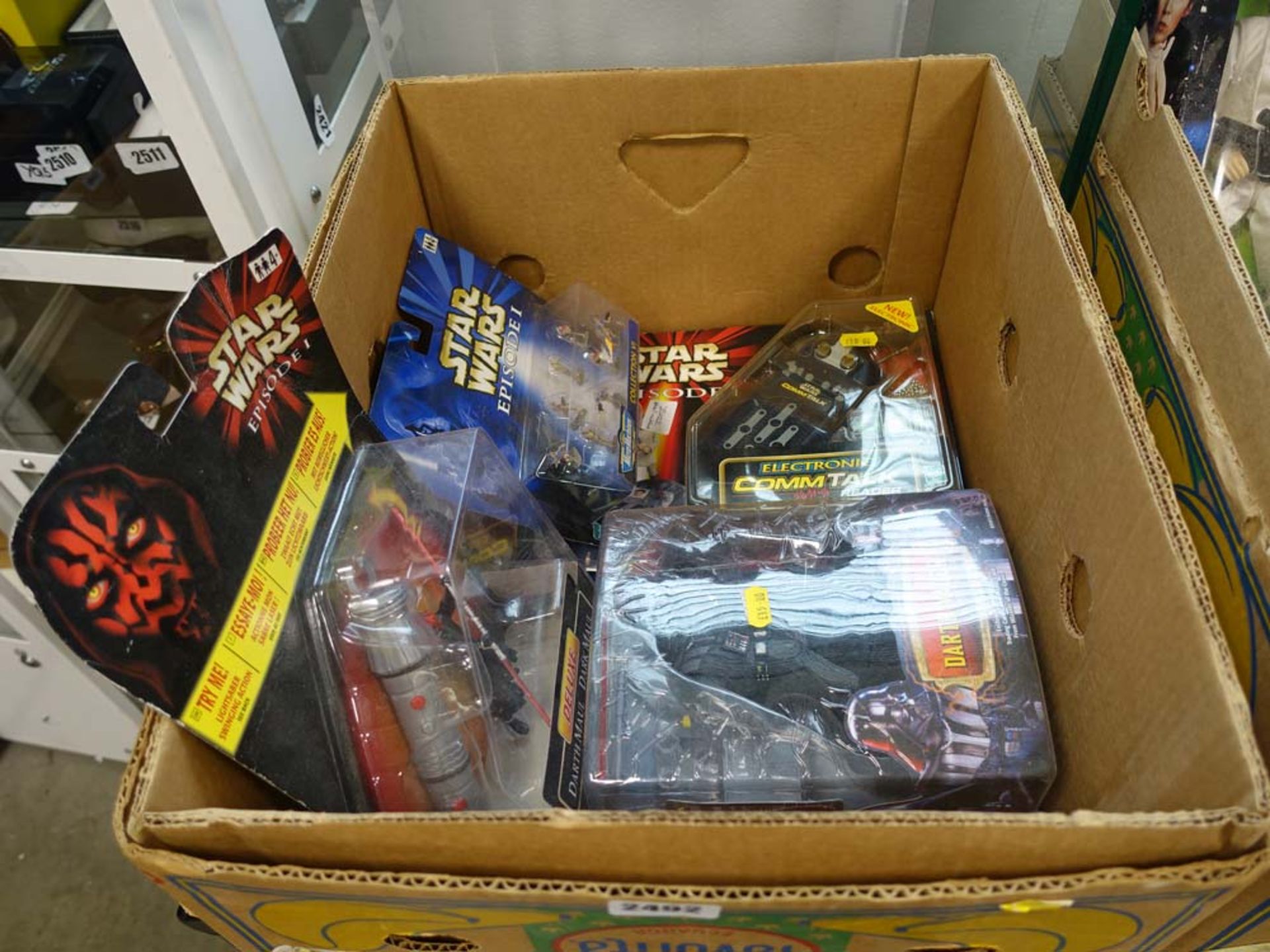 Star Wars collectible figures and accessories in sealed packaging to include Darth Vader, Star